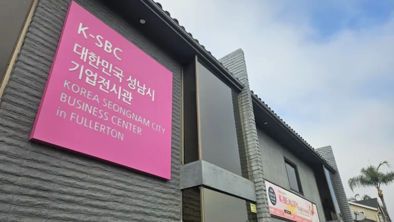 Exterior view of K-SBC Korea Seongnam City Business Center in Fullerton with bright pink signage